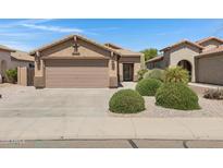 Charming single-story home featuring a two-car garage and desert landscaping in a well-maintained community at 2318 W Kristina Ave, San Tan Valley, AZ 85144