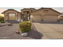 Charming single-story home featuring a well-manicured yard and a spacious two-car garage at 462 S Marie Dr, Chandler, AZ 85225
