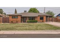 Lovely brick home featuring a lush green lawn and a tidy, inviting facade at 5605 N 19Th St, Phoenix, AZ 85016