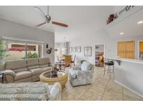 Bright living room with tile flooring, ceiling fan, neutral paint and backyard access at 5830 E Mckellips Rd # 30, Mesa, AZ 85215
