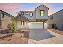 Charming two-story home featuring a two car garage, neutral color palette and low maintenance landscaping at 630 W Laredo St, Chandler, AZ 85225