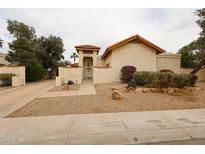 Charming single-story home featuring a desert-landscaped front yard and gated entry, perfect for curb appeal at 5120 E Janice Way, Scottsdale, AZ 85254