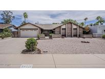 Charming single-story home with well-maintained landscaping and a two-car garage at 14221 N 45Th St, Phoenix, AZ 85032