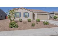 Attractive single-story home featuring desert landscaping and blue shutters at 2775 N Mulberry Pl, Casa Grande, AZ 85122