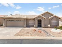 Charming single-story home featuring a low maintenance yard, covered entryway, and attached two-car garage at 6942 S Championship Dr, Chandler, AZ 85249