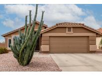 Charming single-story home with desert landscaping and a two-car garage at 1033 E Mountain Vista Dr, Phoenix, AZ 85048