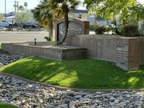 Community sign featuring the Chesapeake Condominiums logo surrounded by desert landscaping at 200 E Southern Ave # 133, Tempe, AZ 85282