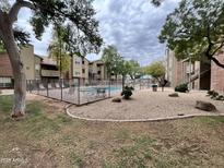 Relaxing community pool area with lounge chairs and outdoor seating, perfect for enjoying the Arizona sunshine at 200 E Southern Ave # 133, Tempe, AZ 85282