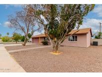 Cozy single-story house with a tidy front yard and attached two-car garage on a sunny day at 3916 W Northview Ave, Phoenix, AZ 85051