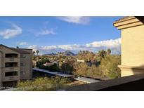 Scenic view features community landscaping and a mountain background with the azure sky enhancing the property's allure at 920 E Devonshire Ave # 4021, Phoenix, AZ 85014