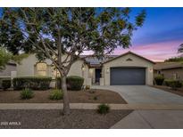 Charming single-story home featuring well-maintained landscaping and a spacious two-car garage at 15360 W Corrine Dr, Surprise, AZ 85379