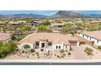 Stunning aerial view of a well-maintained single-Gathering home with a desert landscape and scenic mountain backdrop at 6032 E Thunder Hawk Rd, Cave Creek, AZ 85331