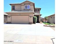 Charming two-story house with a welcoming facade and a convenient two-car garage at 8769 W Shaw Butte Dr, Peoria, AZ 85345