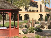Attractive desert landscaping enhances this building in the community, with a gazebo and mature trees at 10330 W Thunderbird Blvd # B201, Sun City, AZ 85351