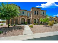Beautiful stone and stucco home with a landscaped front yard and welcoming entrance at 20750 N 87Th St # 2038, Scottsdale, AZ 85255