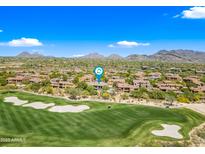 Beautiful aerial view of a scenic golf course with lush green fairways and sand traps in Scottsdale, Arizona at 20750 N 87Th St # 2038, Scottsdale, AZ 85255