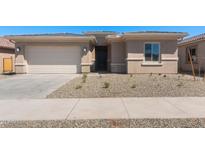 Charming single-story home featuring a two-car garage and freshly xeriscaped front yard at 674 W Rock Needle Trl, Apache Junction, AZ 85120