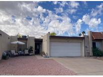 Charming single-story home with a private courtyard and attached two-car garage at 849 W Duke Dr, Tempe, AZ 85283