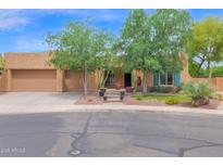 Charming single-story home featuring desert landscaping, a two-car garage, and a welcoming front entrance at 2246 E Crescent Pl, Chandler, AZ 85249