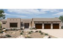 Stunning single-story home boasts a spacious three-car garage and desert landscaping at 24422 N 128Th Way, Scottsdale, AZ 85255