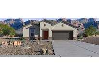 Charming single-story home featuring desert landscaping and a two-car garage with mountain views at 5751 E Axle Ln, San Tan Valley, AZ 85140