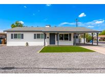 Charming single-story home with a covered porch, stone landscaping, and fresh curb appeal at 6316 N 23Rd Ave, Phoenix, AZ 85015