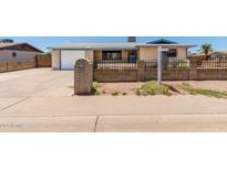 Charming single story brick home with a well manicured front yard and inviting curb appeal at 900 S Palo Verde Dr, Apache Junction, AZ 85120
