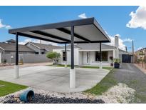 Attractive home with a stylish carport, artificial turf landscaping and desert accents at 2236 N 22Nd St, Phoenix, AZ 85006