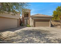 Charming single-story home with a three-car garage, beautiful landscaping, and a tile roof on a sunny day at 16450 E Avenue Of The Fountain -- # 47, Fountain Hills, AZ 85268