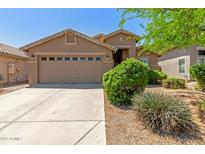 Charming single-story home with a two-car garage, desert landscaping, and neutral stucco exterior at 3313 W Five Mile Peak Dr, San Tan Valley, AZ 85144