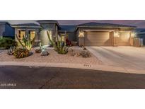 Inviting single-story home featuring desert landscaping, a two-car garage, and a tile roof at 582 W Stirrup Ln, San Tan Valley, AZ 85143