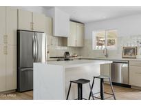 Well-equipped kitchen featuring a stainless steel refrigerator, and a functional island at 6351 E Waltann Ln, Scottsdale, AZ 85254