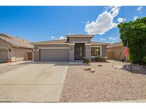 Charming single-story home featuring a low maintenance desert landscape, covered entry and two car garage at 81 E Rock Wren Dr, San Tan Valley, AZ 85143