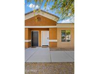 Inviting front doors of the home, featuring a well-maintained walkway and charming curb appeal at 854 S San Marcos Dr # A12, Apache Junction, AZ 85120