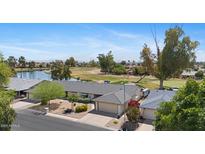Charming home with a two-car garage, beautiful landscaping, and stunning golf course views at 11627 S Jokake St, Phoenix, AZ 85044