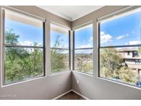 Corner windows offer panoramic views of Arizona landscape, bringing the outdoors inside at 19777 N 76Th St # 3238, Scottsdale, AZ 85255