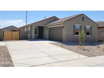 Charming single-story home featuring a low-maintenance desert landscape and neutral color palette at 322 S San Christo Ln, Casa Grande, AZ 85194