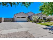 Inviting single-Gathering home featuring a three-car garage and beautiful landscaping in a suburban setting at 2813 E Crescent Way, Gilbert, AZ 85298