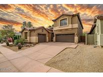 Attractive two-story home with a two-car garage and drought-resistant landscaping at 3054 W Eagle Claw Dr, Phoenix, AZ 85086