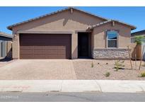Charming single-story home with a brown garage door, desert landscaping, and a welcoming front entrance at 4182 W Lisa Ln, San Tan Valley, AZ 85144