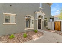 Charming townhome features a covered front door and well-maintained landscaping at 2402 E 5Th St # 1621, Tempe, AZ 85288