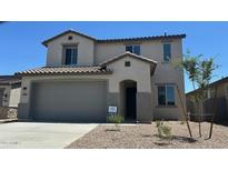 Charming two-story home featuring a neutral color palette and a convenient two-car garage at 25151 W Wayland Dr, Buckeye, AZ 85326