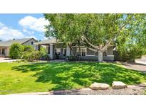 Charming single-story home featuring a lush lawn and mature shade tree at 139 W Granada Rd, Phoenix, AZ 85003