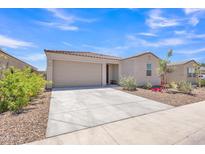 Charming single-story home with a well-manicured front yard and two car garage under a clear blue sky at 18501 E Donato Dr, Gold Canyon, AZ 85118