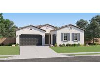 Charming home with a two-car garage, a single car garage and desert landscaping at 2912 E Lucky Horseshoe Ln, San Tan Valley, AZ 85140