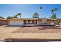 Charming single-story home with a well-maintained desert landscape and a spacious two-car garage at 720 S Rosemont --, Mesa, AZ 85206