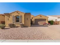 Charming single-story home with a red motorcycle, desert landscaping, and inviting curb appeal at 870 E Tonto Pl, Chandler, AZ 85249