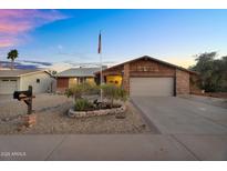 Charming single-story home featuring a well-maintained yard and two-car garage at 10743 W Frier Dr, Glendale, AZ 85307