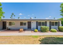 Charming single-story home with landscaped front yard and blue sky at 13261 N 110Th Ave, Sun City, AZ 85351