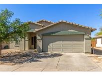 Charming single-story home featuring a two-car garage, desert landscaping, and a welcoming front entrance at 2122 W Alta Vista Rd, Phoenix, AZ 85041